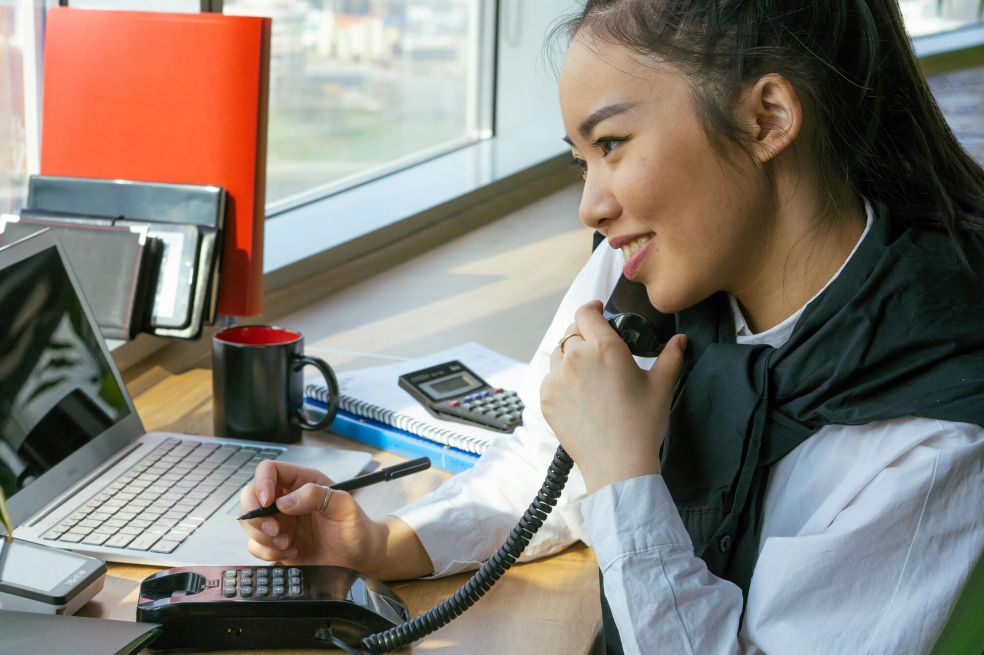 CEO working with executive assistant in modern office